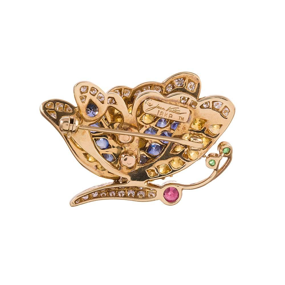 A charming little creature to adorn your lapel. We recommend wearing it pinned next to your favorite flower brooch! This sweet butterfly is decorated with 24 yellow sapphires, 39 diamonds, 15 blue sapphires, 2 tsavorite garnets and one ruby… all set