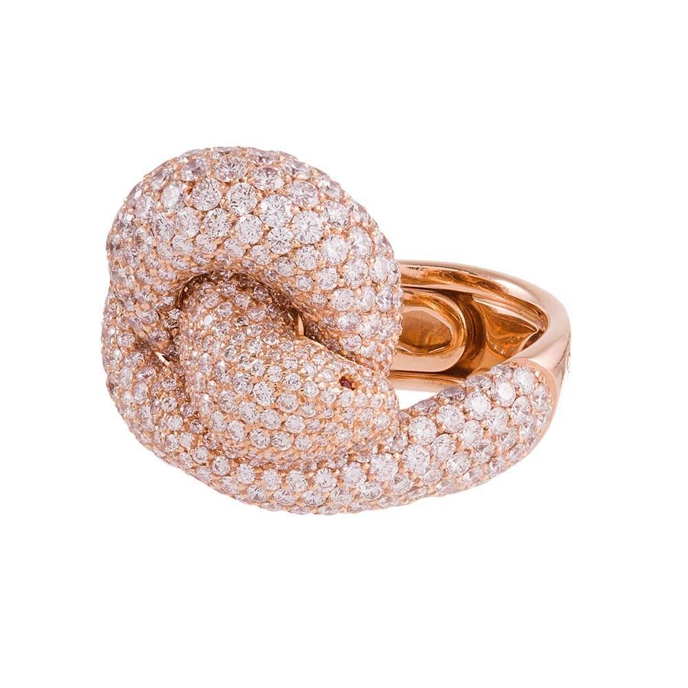 An undulating ribbon of diamonds fashioned into a serpent, it’s head distinguished from its body by a pair of ruby-set eyes. This is among the finest examples of a snake motif ring we have had the pleasure of offering for sale. Made of 18k rose gold