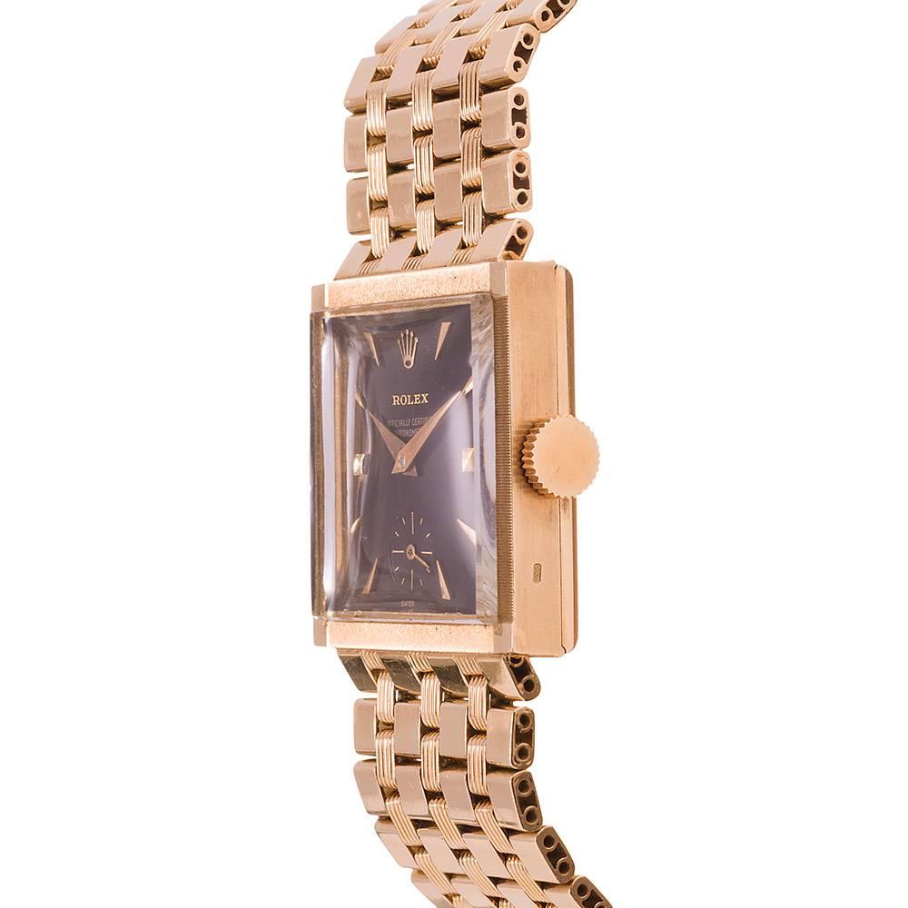 An exceptionally uncommon example that would suit the collector of vintage rarities, noted for multiple special details. Rolex produced very few square case watches of any variety. This piece has an unusual textured bezel with polished corners, a