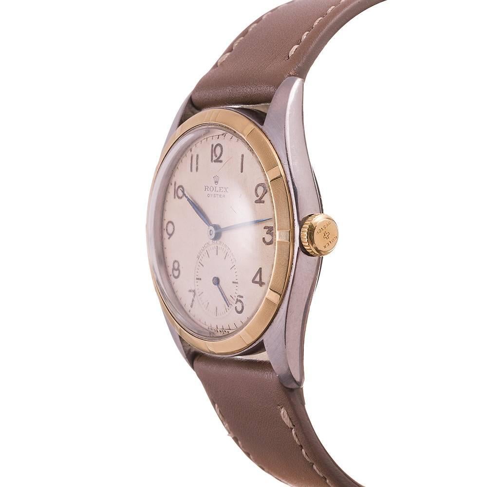 A handsome dress watch with distinct vintage character offering stylized Arabic numerals, sub seconds and like new condition. The case back still has all of the original printing visible- nice an crisp! The watch has an overall beautiful patina and