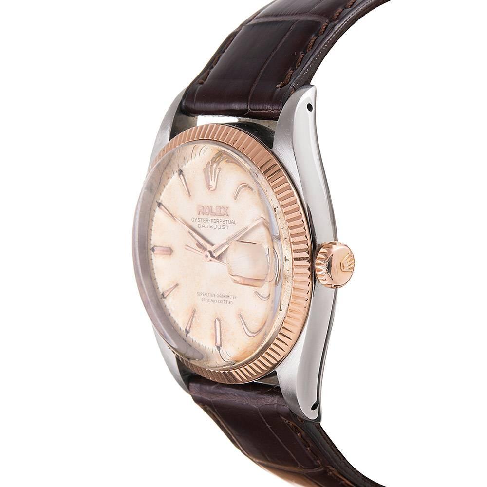 A truly vintage looking vintage time piece with a distinctive tropical patina enhanced by original stylized hands. Rose gold and stainless steel models from this era are exceedingly scarce, making this quite a find. Reference #6605 has a 1006