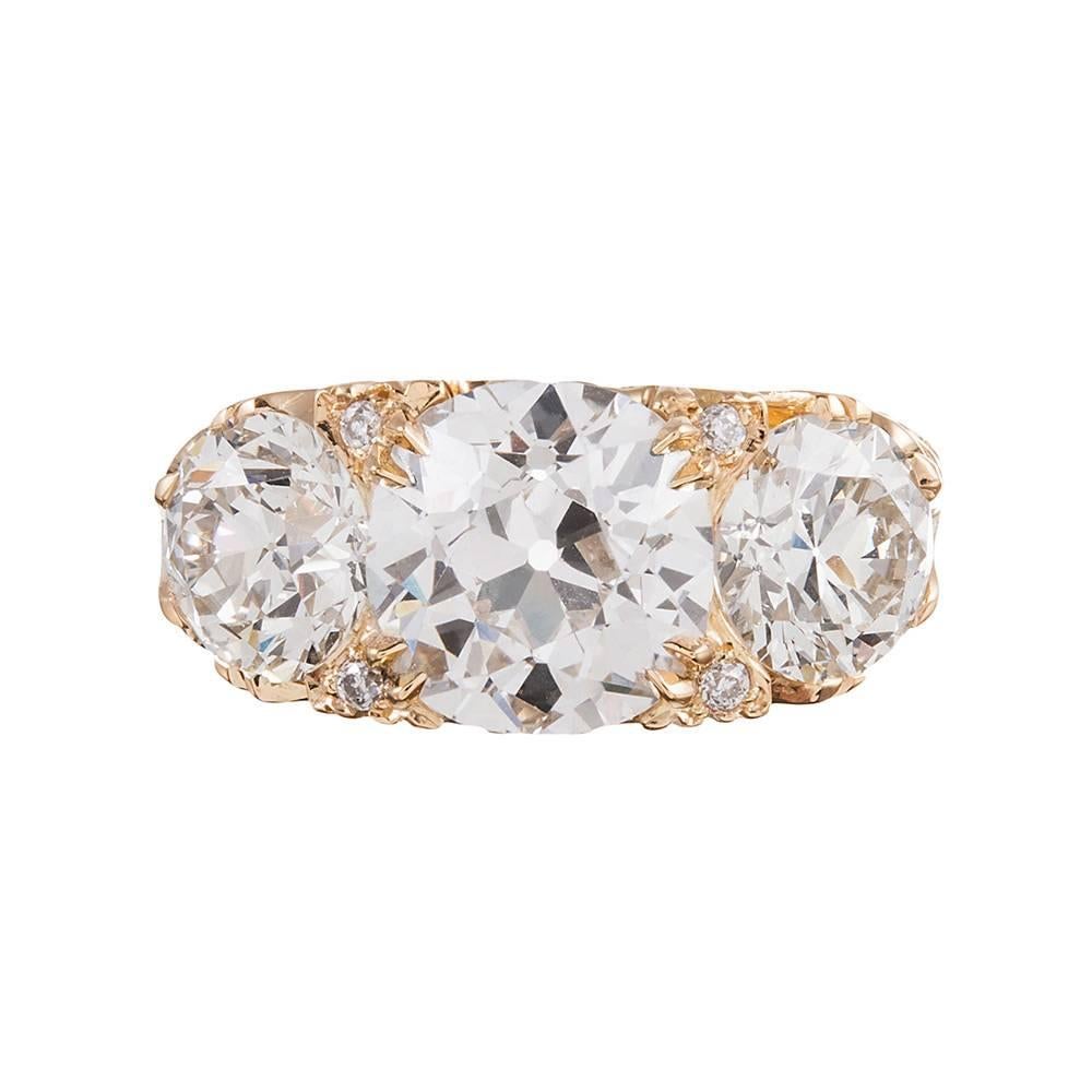 6.62 Carat English Carved Style Three-Stone Diamond Ring