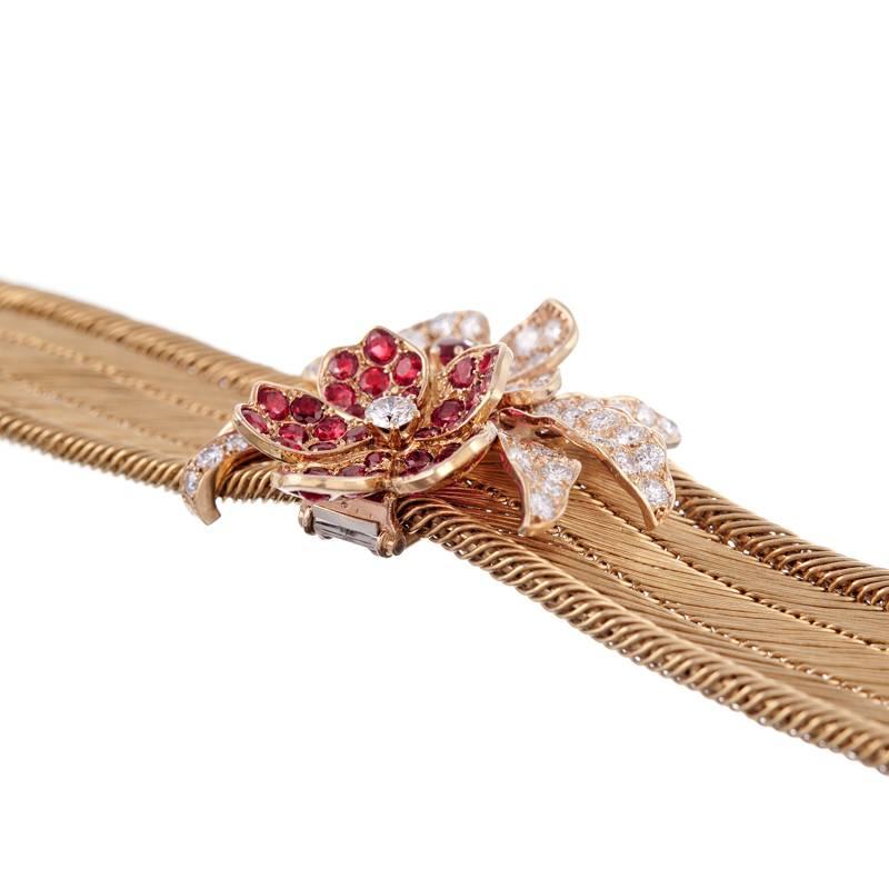 Stunning hand, stunning design, stunning detail: This is one of those pieces that will bring a smile to any jewelry enthusiast. The bracelet itself is a sensuous ribbon of golden mesh which has absolutely gorgeous flow, draping over the wrist like a