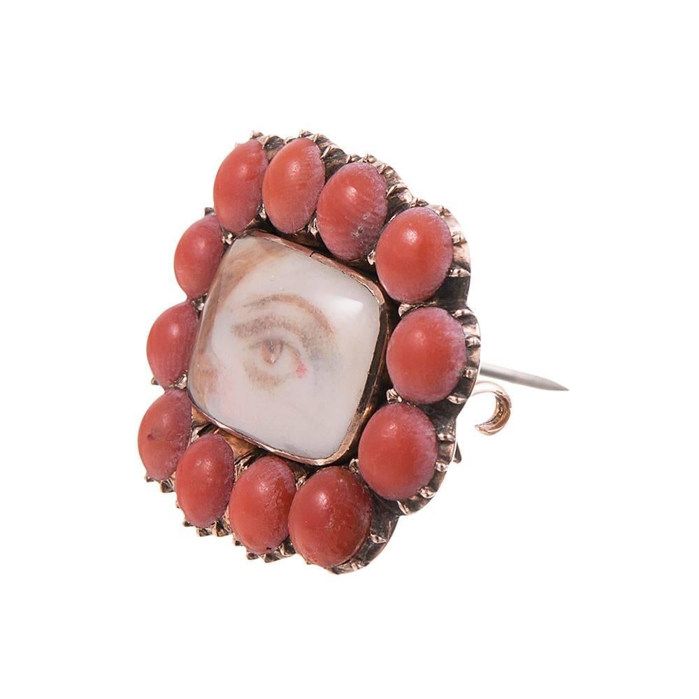 Lover’s eyes are a coveted category among antique jewelry genres and this piece represents an extremely rare example. Not only is the subject a redhead, but she is framed in coral cabochons- a combination we have not seen until now. The piece