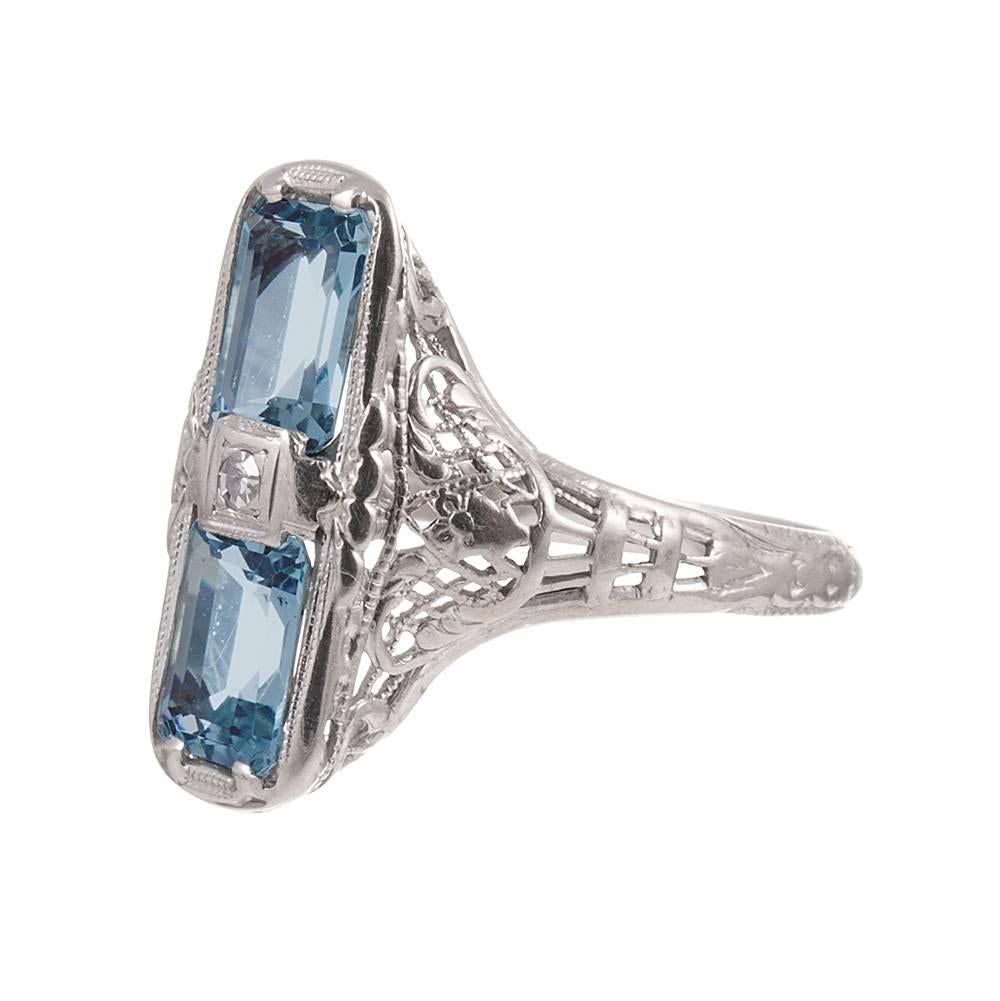 14k white gold filigree plaque ring set with aquamarine and diamonds. The top measures 3/4 of an inch long. What a sweet treat! Size 5.25 can be resized on request. 
