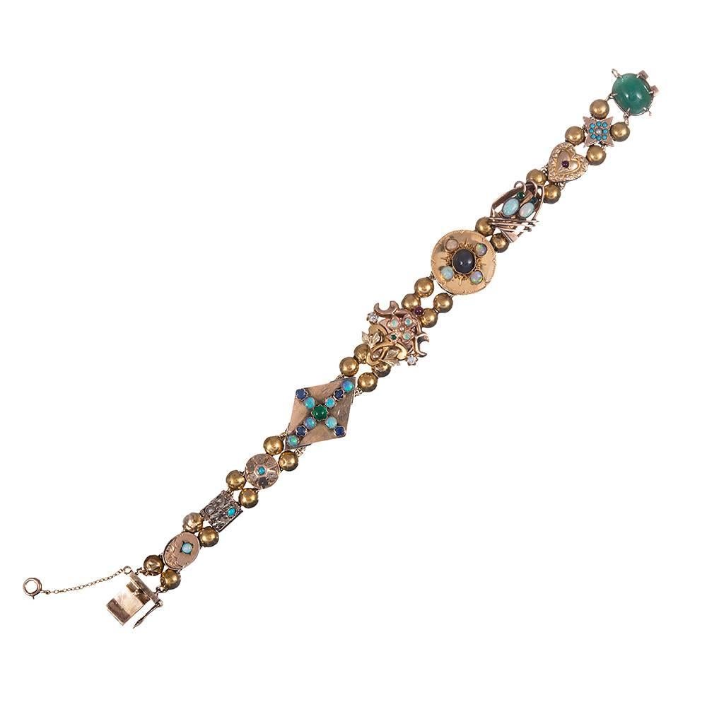 A collection of ten Victorian slides, strung together and forming a sort of charm bracelet, a popular repurposing of Victorian motifs most typically assembled in the 1950s. This one measures just a hint over 7 inches long and includes some