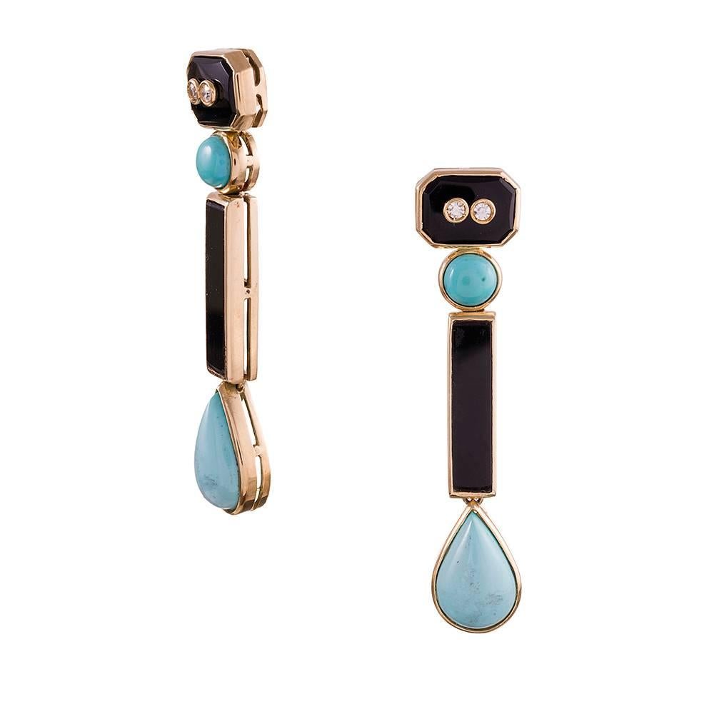 A fun combination of geometrics balanced atop each other to form an artful totem, these earrings consist of a 2 1/8 inch stack of alternating onyx and turquoise, each section set in a bezel of 18 karat yellow gold and the top decorated with a pair
