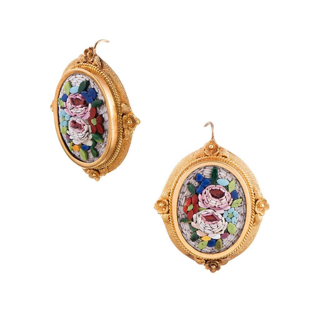 A lovely pair of micro mosaic earrings, displaying a bouquet of flowers in a frame of 18 karat yellow gold. Look closely and appreciate the enormous amount of detail that make these so special. 1 inch by 7/8 of an inch. 