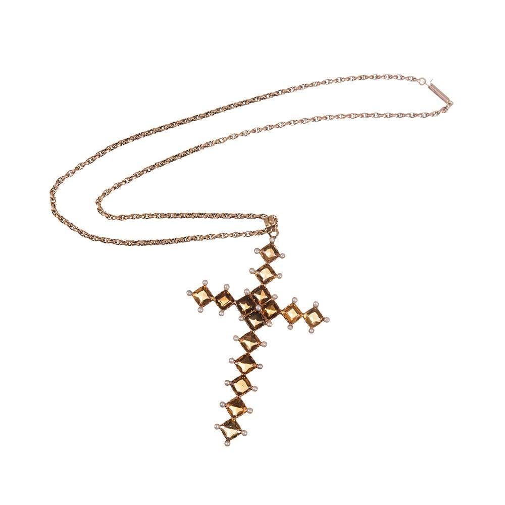 Impressively sized at 2.5 inches high and just over 2 inches wide, this beautiful Victorian cross pendant will make a lovely addition to your collection. Conceived as an assembling of square citrines and dotted with seed pearls at each tip. Mounted