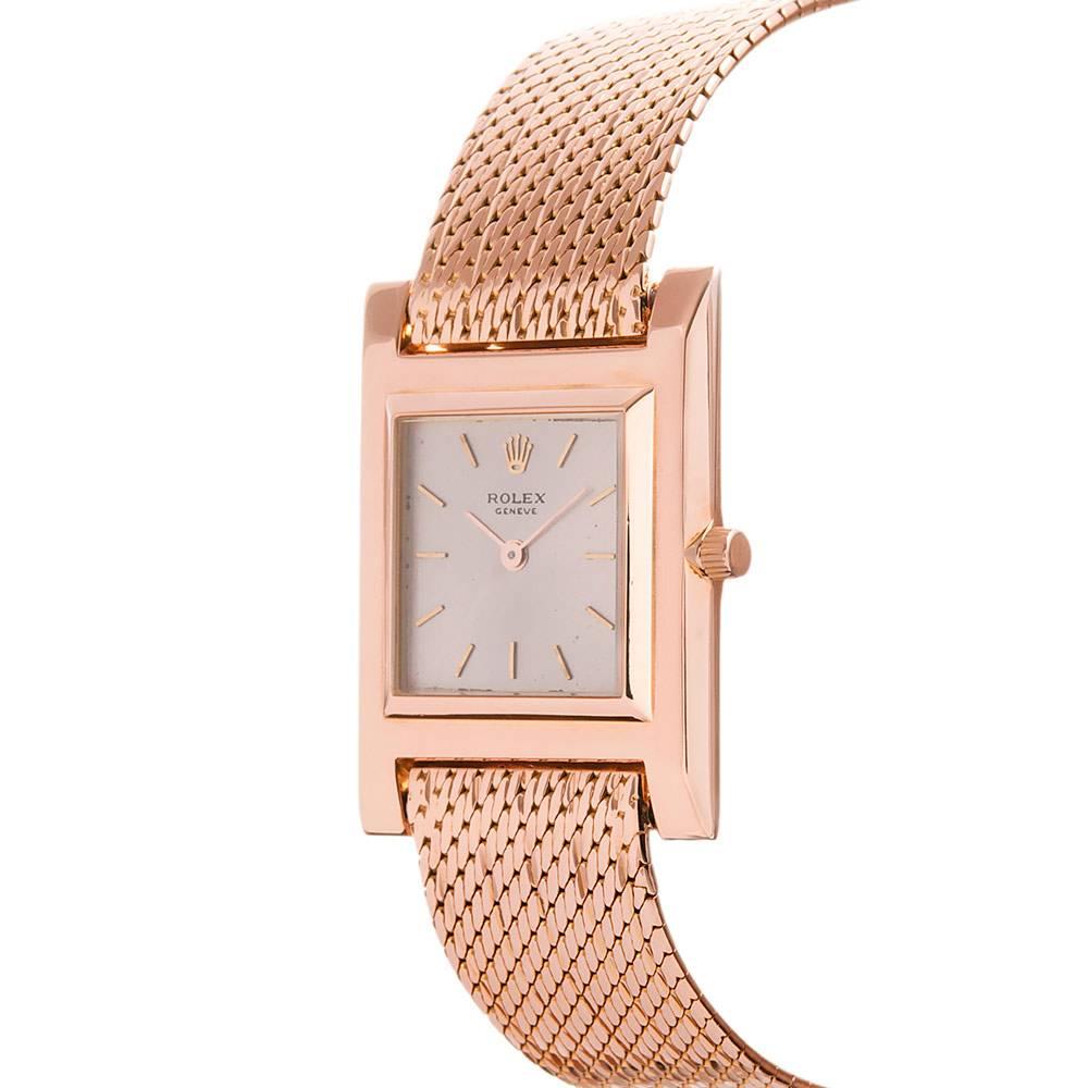 An uncommon and beautiful vintage Rolex dress watch, unique for many reasons, with each layer of detail amplifying the overall rarity. Made of 18k rose gold with an incredibly thin square case, the watch is also noted for the accompaniment of its