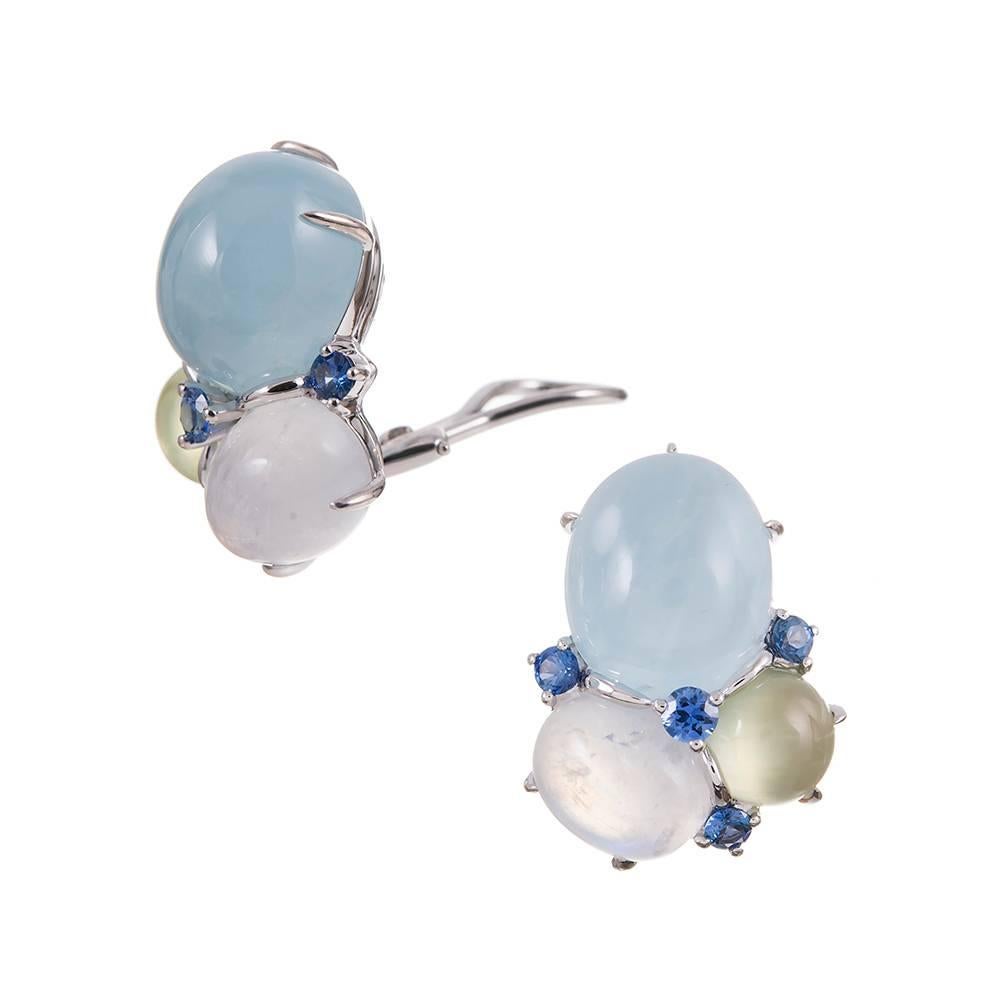 A collection of softly-hued cabochon gemstones complimented by faceted sapphires, compliments of iconic American jeweler Seaman Schepps. The aquamarines weigh 20.40 carats in total, the moonstones 9.66 carats, the phrenite 5.46 and the sapphires .21