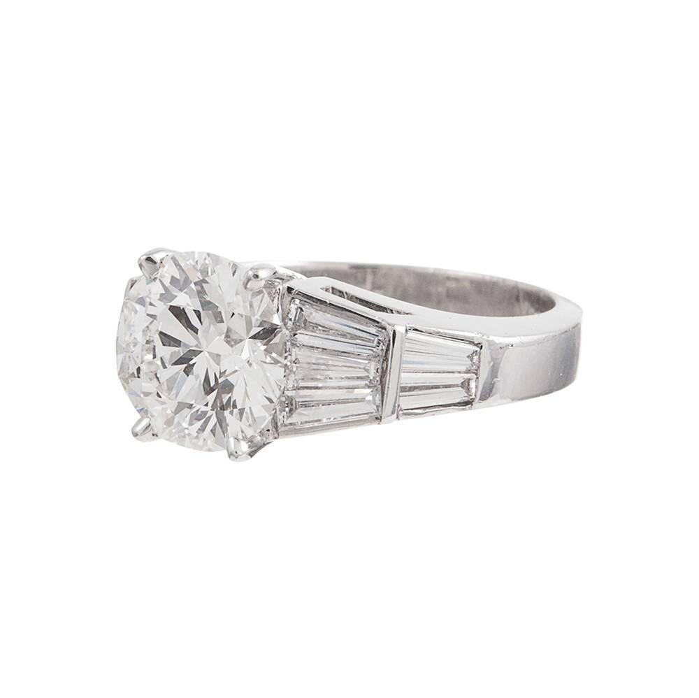 Beautiful classic diamond solitaire ring set in a substantial platinum mounting and featuring one major brilliant center round diamond. The diamond is accompanied by AGS diamond grading report stating I color with Vvs2 clarity, however, this