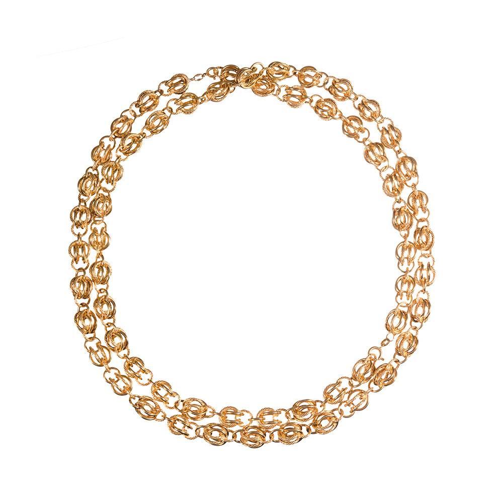 A terrifically unique chain for the jewelry enthusiast, designed as a series of orb-like links made of both textured and high polished wires. 40 inches long and finished with a single clasp. 18k yellow gold.