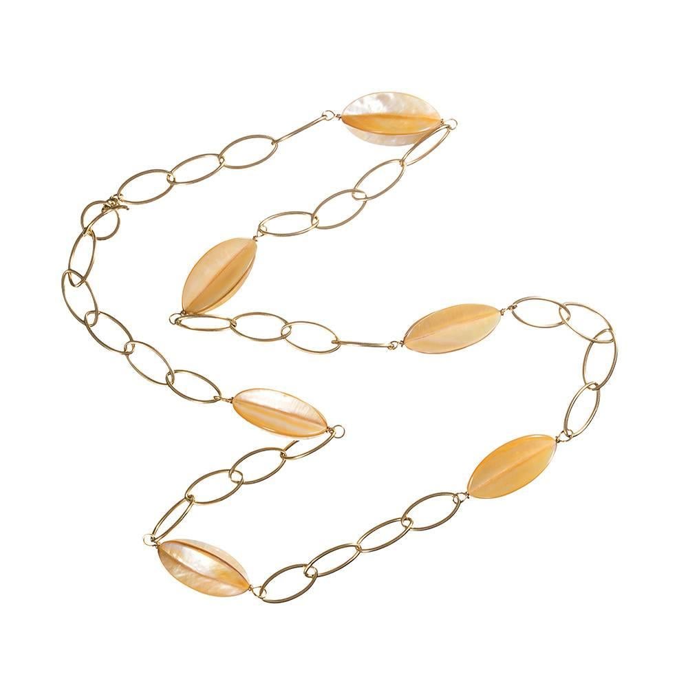 An artful creation with oval links of 18k yellow gold connecting six stations of mother of pearl. Organic chic!