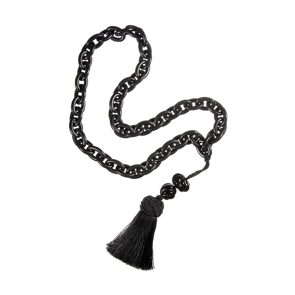Mourning jewelry is in its own category of collectability and has a particular allure of which antique jewelry enthusiasts are quite fond. This substantial necklace is comprised of ¾ inch wide links of gutta percha and measures 30 inches long. It