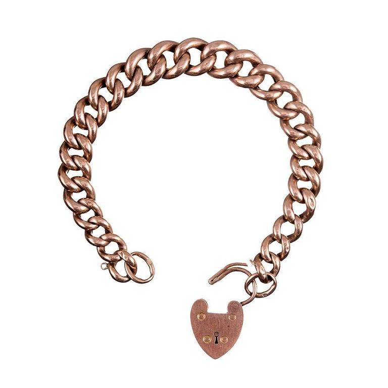 An 8.5 inch classic Victorian gate bracelet, with hand made curb links of 9 karat rose gold. Some are more visible than others, but each link is hallmarked. Finished with a heart-shaped clasp and fitted with loops for a safety chain, however there