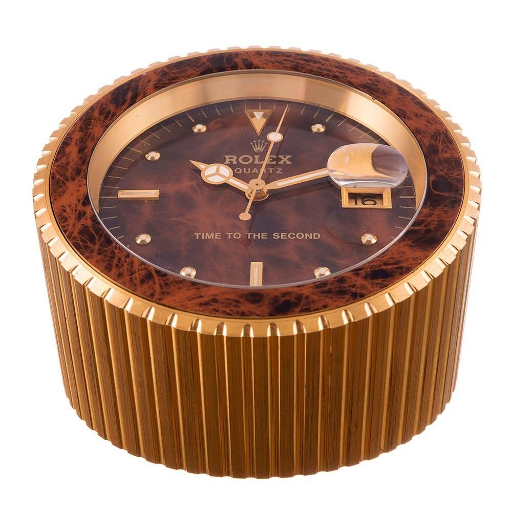 The ultimate gift to bestow upon your favorite Rolex collector, this is an exceptionally cool object that will please your eyes every time they glance in its direction. The clock is heavy and measures 2 inches high, tapering up to 3.5 inches. It has