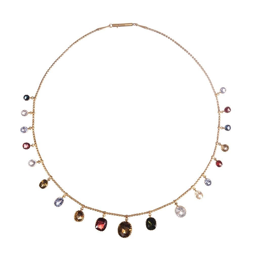 17 inches of playful antique charm, with nineteen assorted gemstones, graduated in size, set in 18k yellow gold and suspended from a handmade chain. The stones move with you and allow light to play off their facets. Many compliments will ensue! 