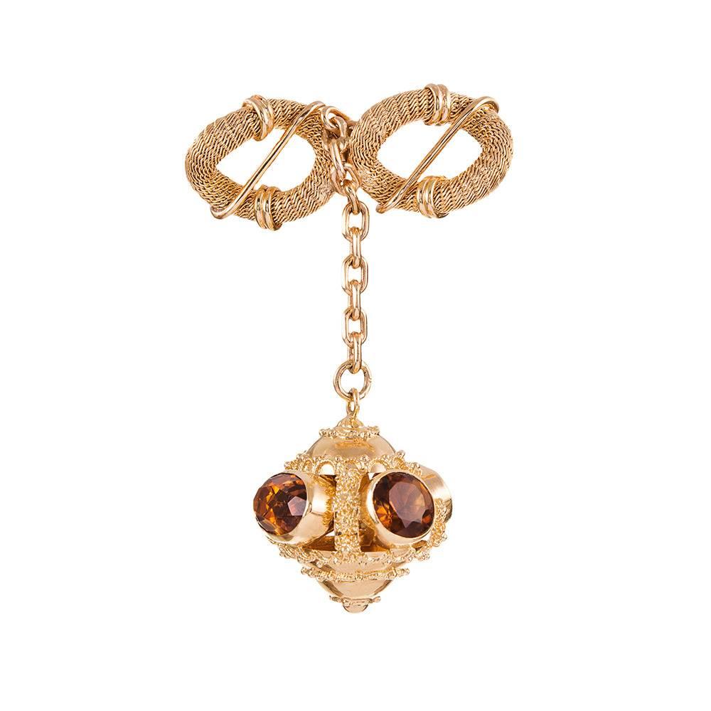 Made of 18k yellow gold and decorated with faceted citrines, this brooch offers gentle movement and absolute beauty from every angle. Texture, granulation and polished strokes of golden wire are a lovely compliment to each other. 3.5 inches long and