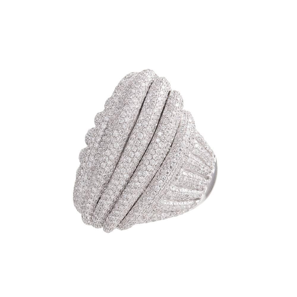Striking diamond ring set with 3.70 carats of brilliant round diamonds that create a textured carpet to adorn your hand. Sweeping across your finger and flowing down the shank, the ring has an enormous presence, yet a comfortable low profile,