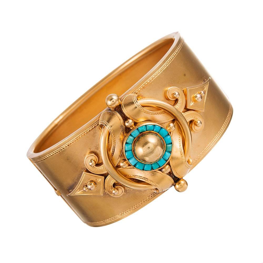 Sculpted, sweeping golden lines decorated with tile set turquoise... this is a distinctively Victorian creation that has striking antique charm, yet still legitimate modern fashion appeal. Originally sold at W. Barker on New Bond St. in London and