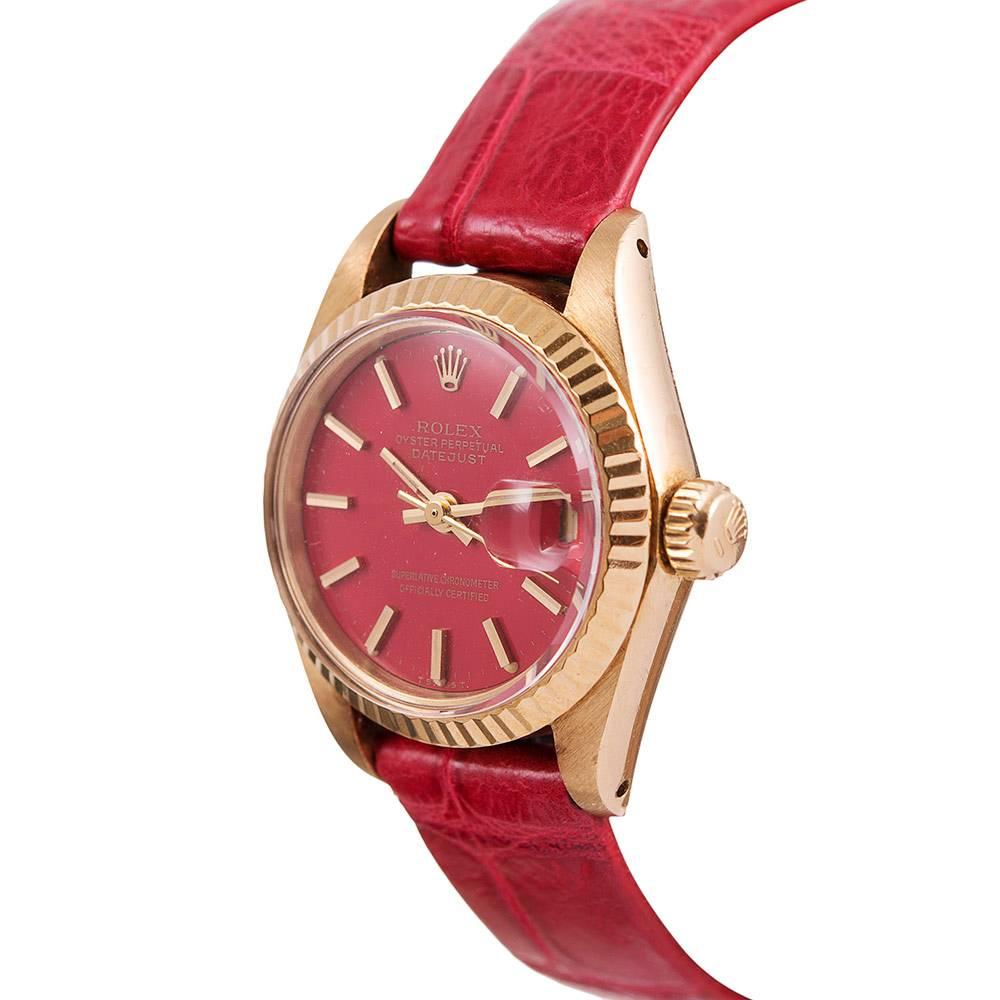 A classic lady Datejust ref. #6917- the most timeless and iconic of Rolex models- enhanced by the exclusive beauty of a Rolex red lacquer "Stella" dial. Original examples of these dials represent their own collectable category among Rolex