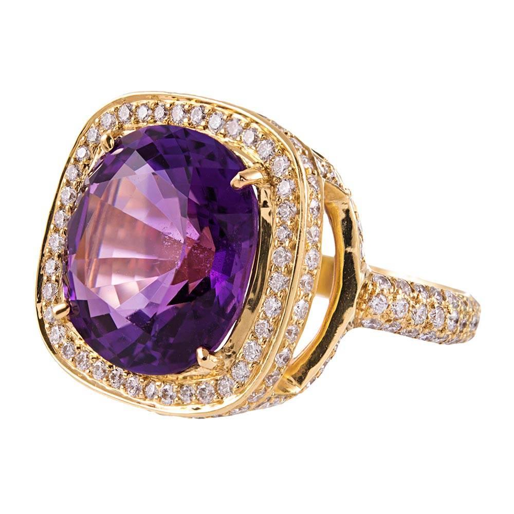 A fun ring, guaranteed to encourage compliments. The center amethyst is framed in a multi-level 18k yellow gold mounting, with sweeping strokes of diamonds. In total, there are 190 brilliant round diamonds that weigh 1.38 carats. Size 6.75 can be
