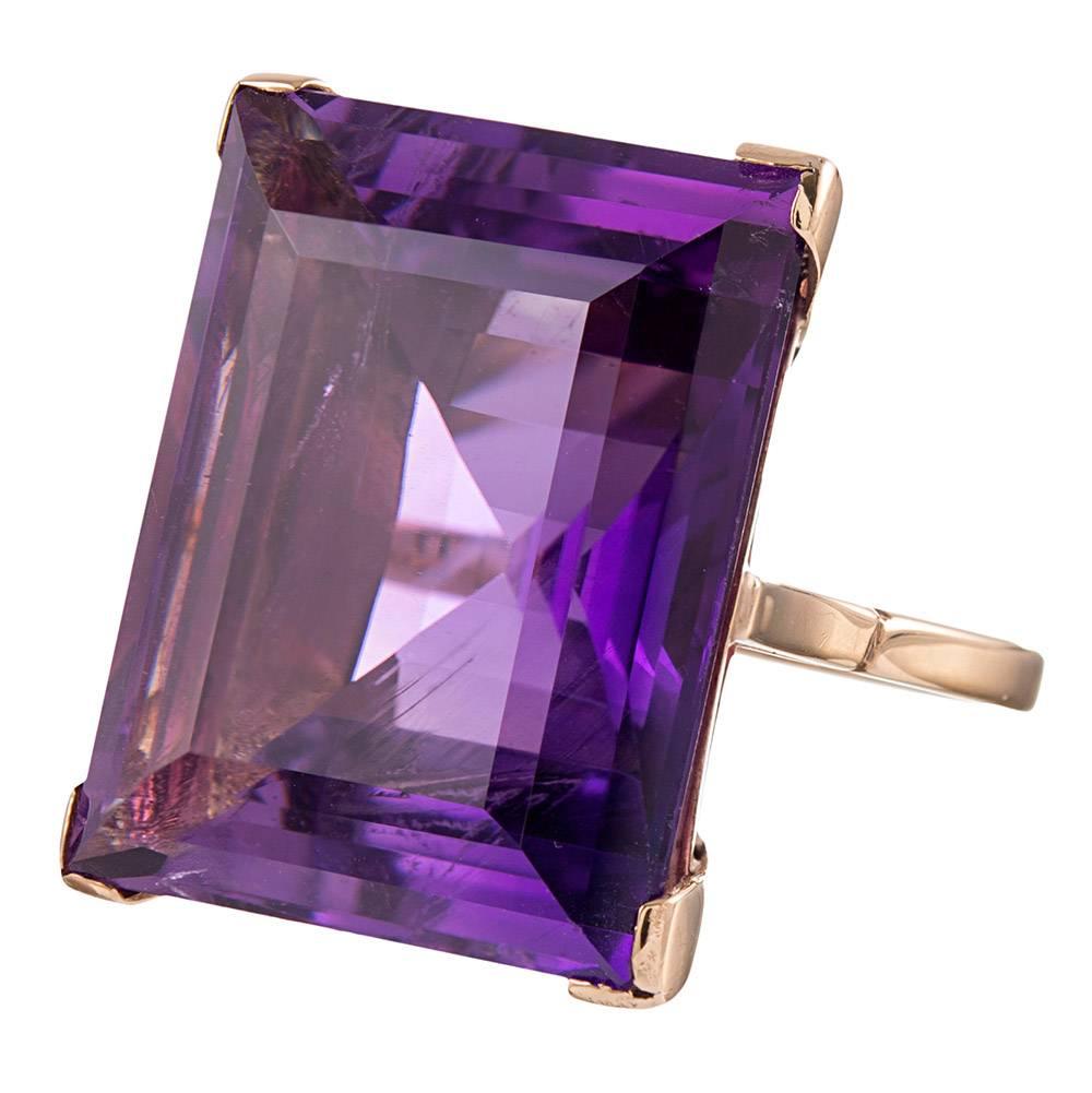 Uncomplicated, yet not uninspired, this 25 carat amethyst sits perched in an 18k yellow gold frame with subtle architectural details. The transparent color of the stone is vibrant and lively. The amethyst measurements are as follow: 23.1 x 18.9