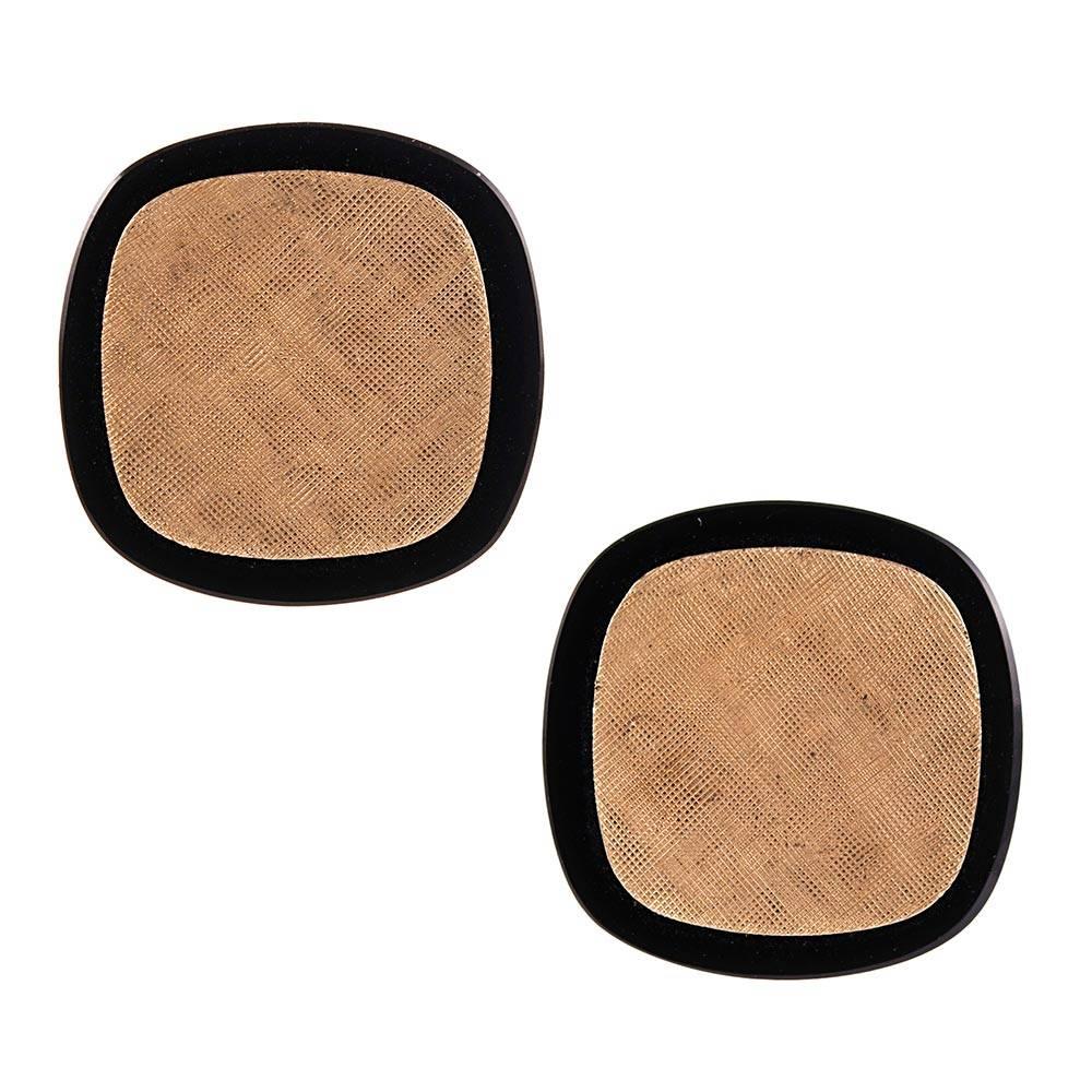 A substantial pair of cufflinks, measuring .75 inches (roughly) square designed as a textured golden centerpiece framed by black onyx. A set of three fitted shirt studs accompany the cufflinks. The black onyx is a dramatic contrast to the soft