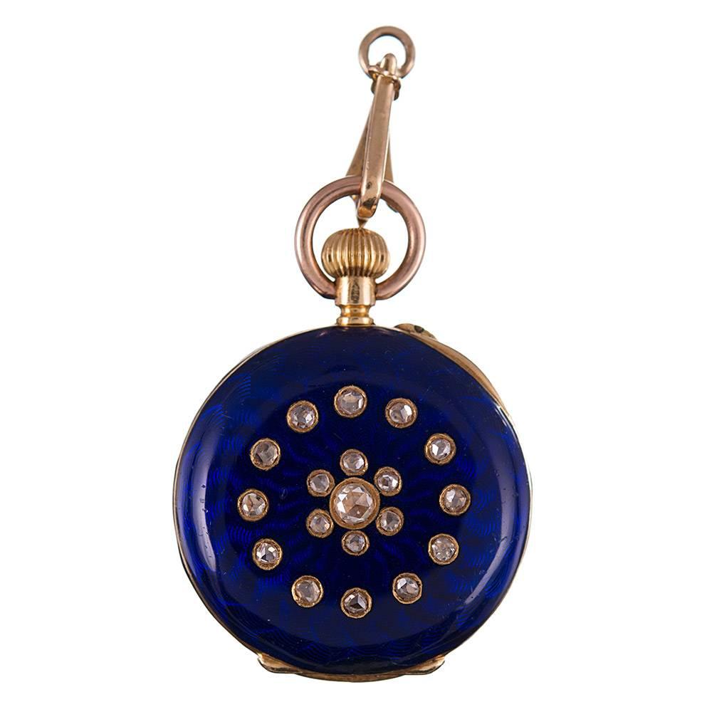 A charming lever-set watch with a porcelain dial, heavily decorated with royal blue enamel and rose cut diamonds. The piece is accompanied by a fitted enamel bale, allowing it to be used as a pendant. The piece measures 2 inches long including the