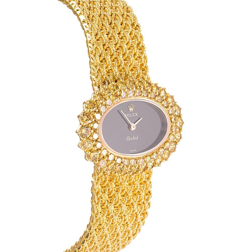 Rolex Ladies yellow gold Orchid Fancy Yellow Diamond Bezel Onyx Dial Wristwatch In Excellent Condition In Carmel-by-the-Sea, CA