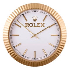 horloge murale Rolex des années 1980 à lunette en or jaune