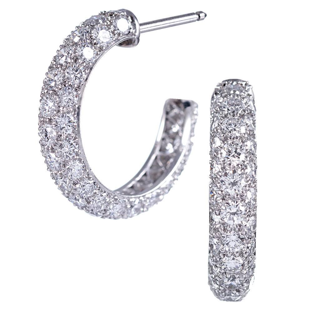 Classic hoop earrings handsomely appointed with approximately 2.00 carats of brilliant round white diamonds. Three rows of diamonds ensure these charmers will sparkle from every angle. Part of the etoile collection, signed Tiffany & Co. Made of