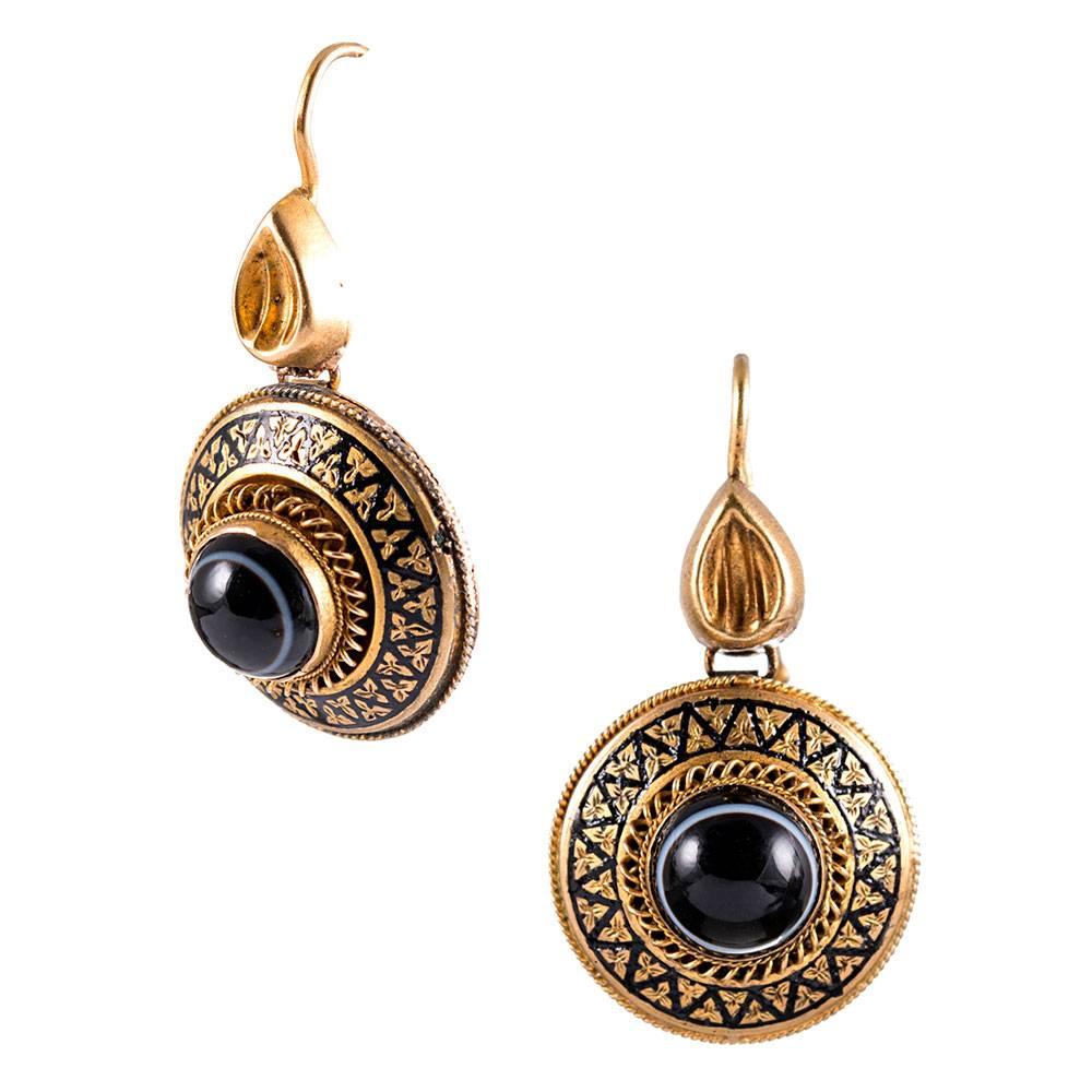 18k yellow gold discs suspended from a pear-shaped finial, anchored in the center with a cabochon of banded agate and decorated with an ornate display of enamel. These little earrings offer a big punch! At 1.25 inches long, they can be your daily