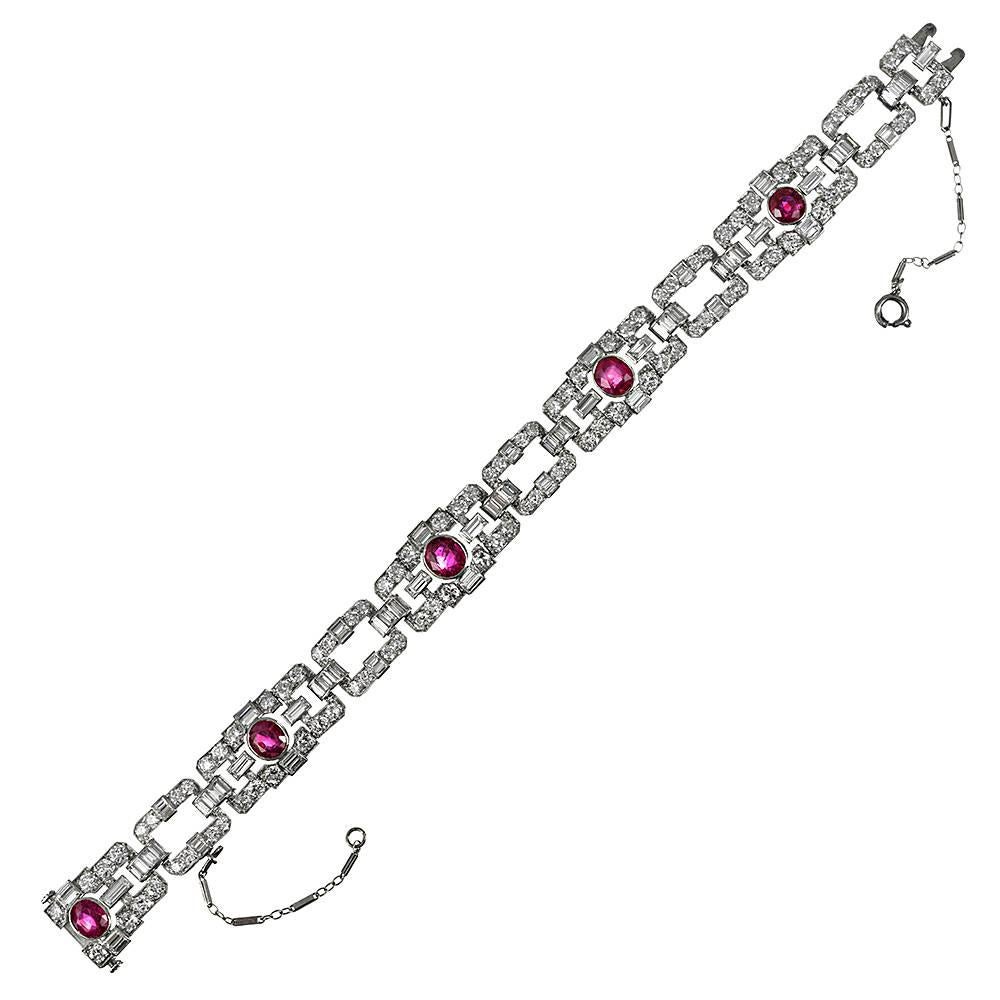 Stunning art deco design, set with the finest of colored gemstones. In total, the platinum bracelet is adorned with 4.75 carats of GIA-graded unheated Burmese rubies, as well as 11.27 carats of round brilliant- and baguette cut diamonds. The quality