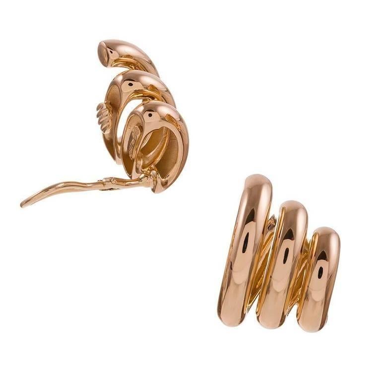 A playful and classic design, compliments of iconic American jeweler Seaman Schepps. Sensuously curved strokes of 18k yellow gold. 1 inch tall and 5/8 inch wide. Currently clips, however, a post can be added on request. Circa modern estate.
