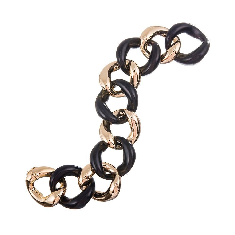 An instant classic, compliments of iconic jewelry designer Seaman Schepps. Hand carved links of ebony alternate with identical links of 18k yellow gold, embracing the classic mid-century aesthetic that is forever chic. Further the impact and wear