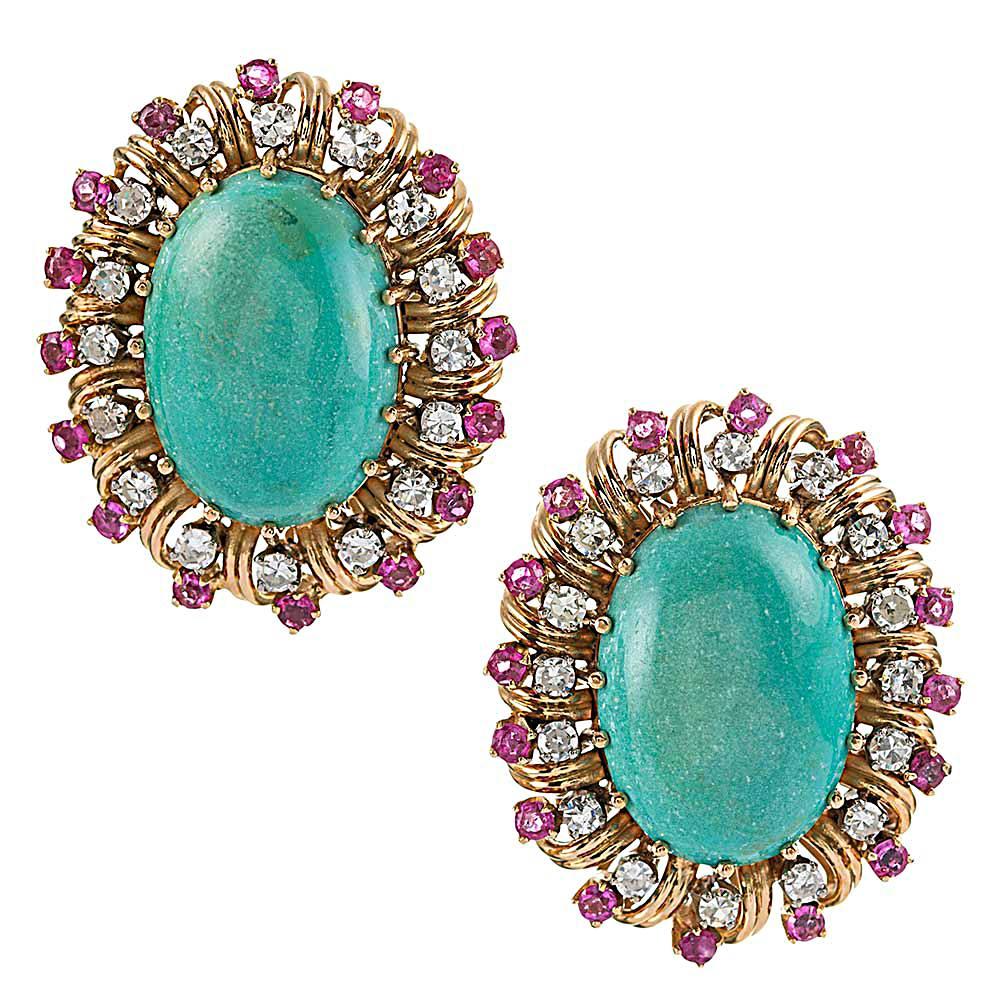 A brilliant color combination that subtly speaks of Americana, this suite will turn heads and encourage both smiles and compliments. The turquoise cabochons are bordered in brilliant white diamonds (2.75 carats in total) and rubies. The earrings are