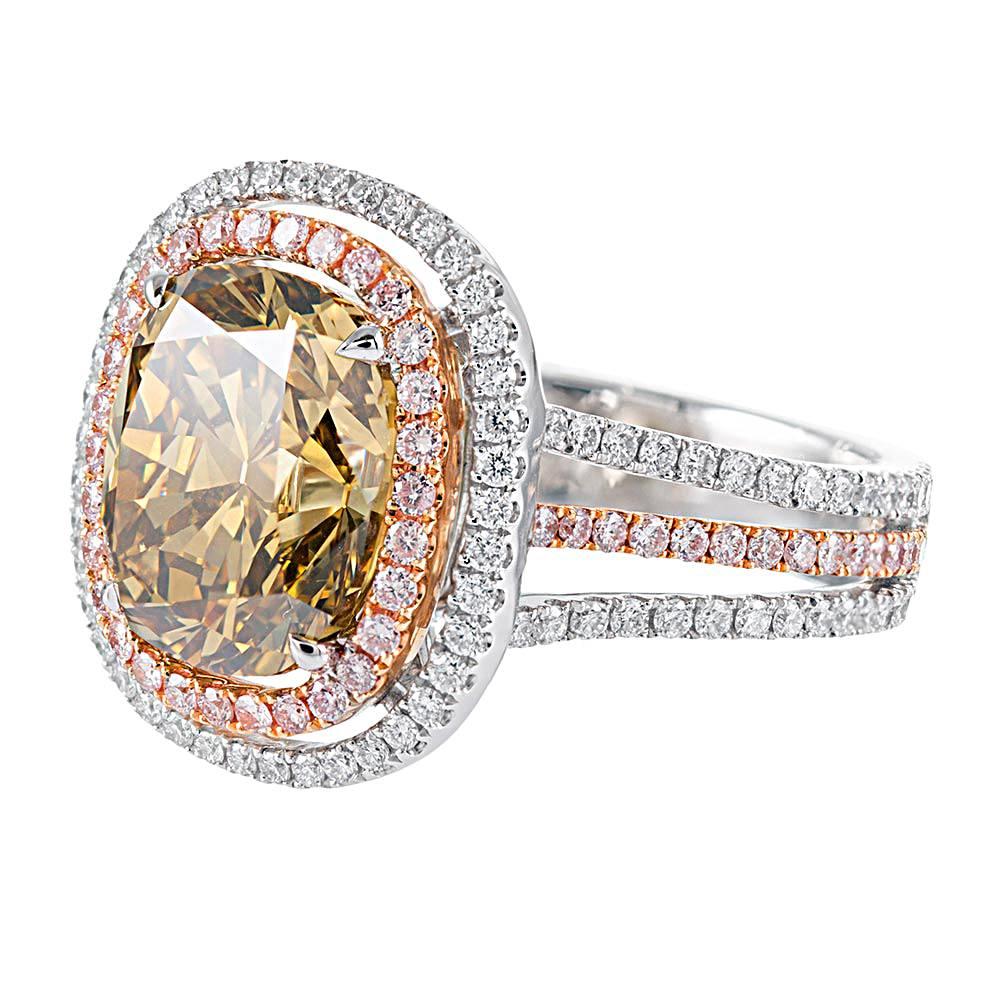 A unique treasure for the colored diamond enthusiast, the stone should be experienced in person to truly be appreciated. GIA describes the 4.60 carat cushion as exhibiting “Fancy dark brownish greenish yellow” color. Boasting striking character and