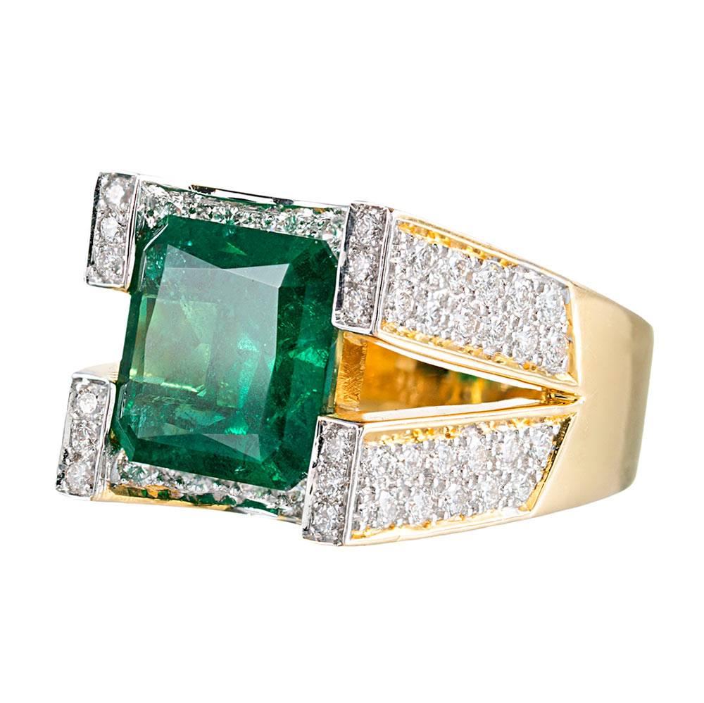 A unique contemporary design does exceptional justice to this beautiful center gemstone. The major emerald weighs 5.00 carats and is described by the accompanying GIA certificate as being of Zambian origin. The color is gorgeous! The emerald is