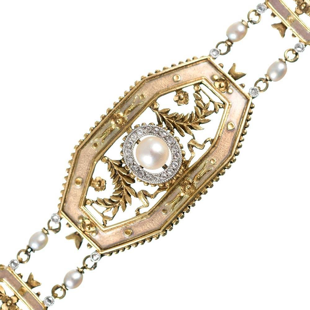 A beautiful and feminine Edwardian design rendered in 18 karat yellow gold, the octagonal links are decorated with rose cut diamonds, pearls, a floral design and a golden-hued enamel to enrich the aesthetic. The bracelet is 7 inches long and 5/8 of