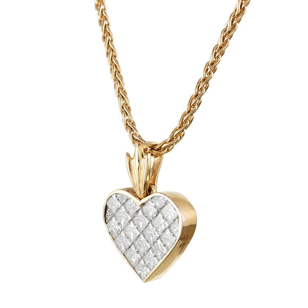 A fun and styled version of the classic heart pendant, with the bale nearly resembling the leaves of a pineapple. The white princess cut diamonds weigh 3 carats in total, but the piece appears to have an even greater diamond weight; it’s both