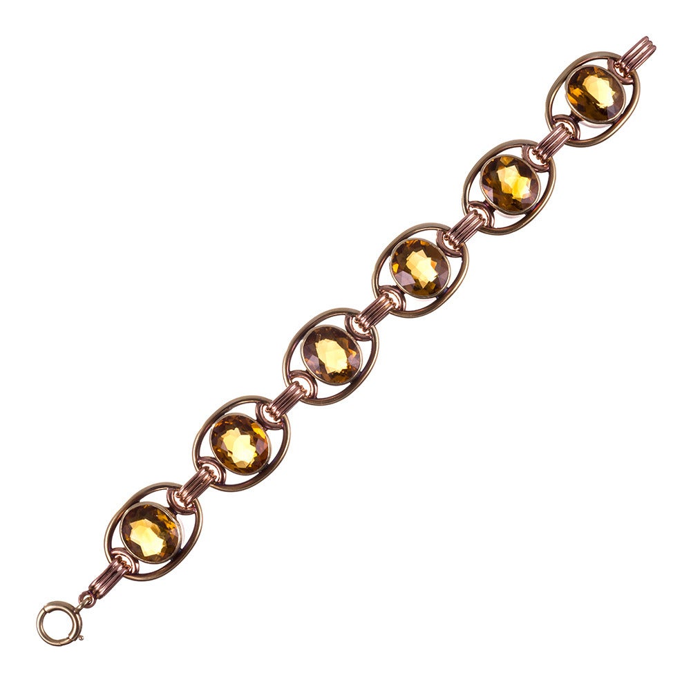 Lovers of retro jewelry will enjoy adding this piece to their wardrobe! Yellow and rose gold links, set with six large faceted citrines, create a neutral color palette that will easily become a staple for your daily attire. The absence of diamonds