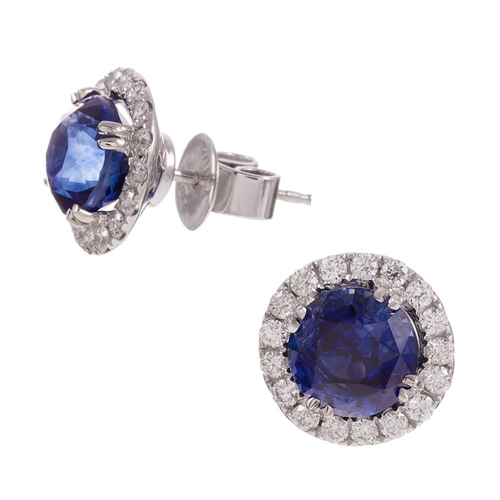 Without question, the ideal choice for she who seeks classic finery with a hint of distinction. If you love the timeless nature of diamond studs, but don’t want what everyone else has, these are the perfect pair! 

The center sapphires weigh 4.93