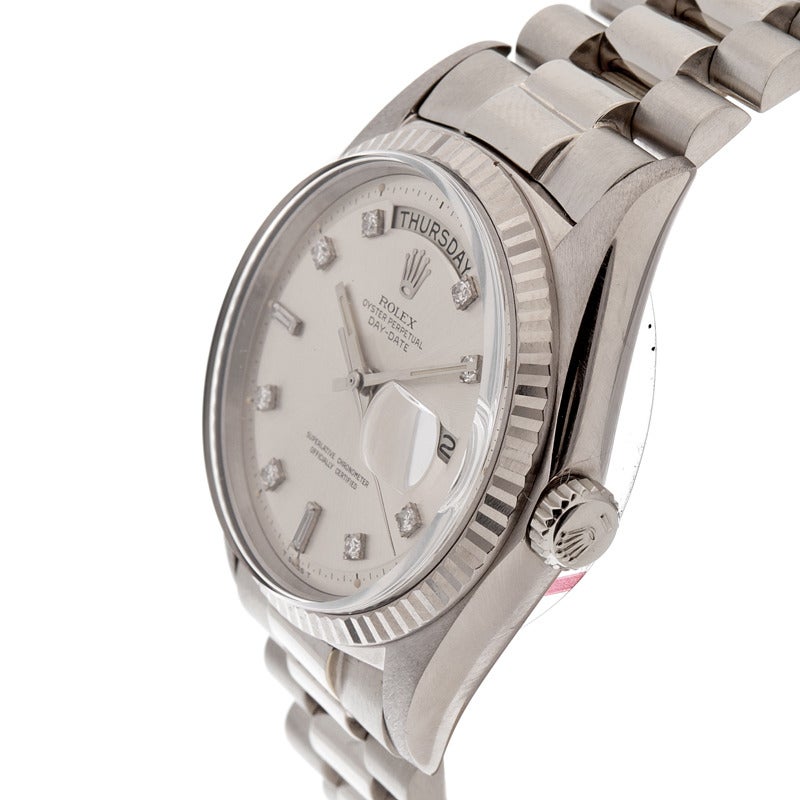 One of the better quality white gold Day-Dates we have seen. The dial is immaculate. All factory diamond dial, with elongated baguette and round markers. The monochromatic look has a very modern feeling, yet the watch is desirable, being from the