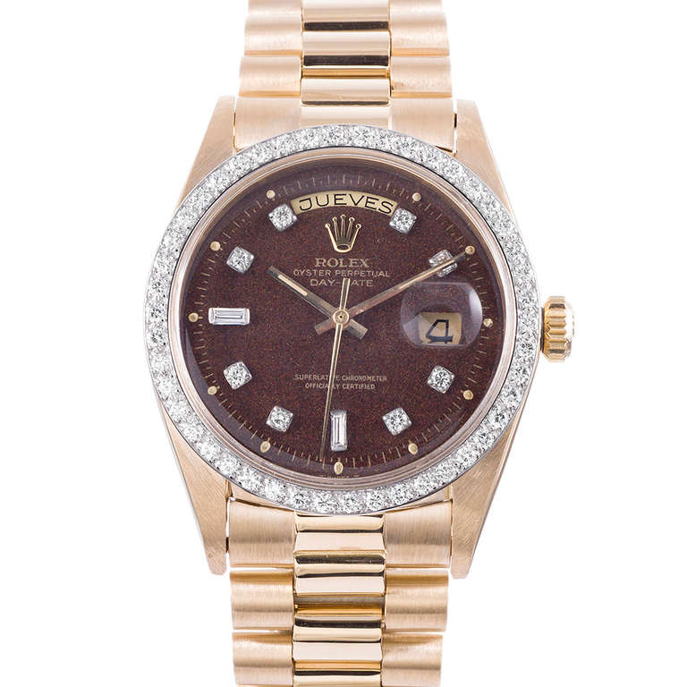 A very unusual variation of the classic Rolex Oyster Perpetual Day-Date wristwatch, Ref. 1803, circa 1970s, with all Rolex factory diamonds on the dial and bezel and a distinctively vintage-looking brown dial with textured specks. The watch is in