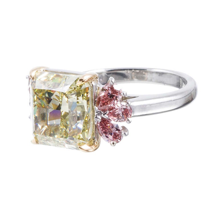 For the lover of all things unique and alluring, a striking diamond ring unlike any you are likely to encounter again. The center diamond weighs 6.12 carats and exhibits 