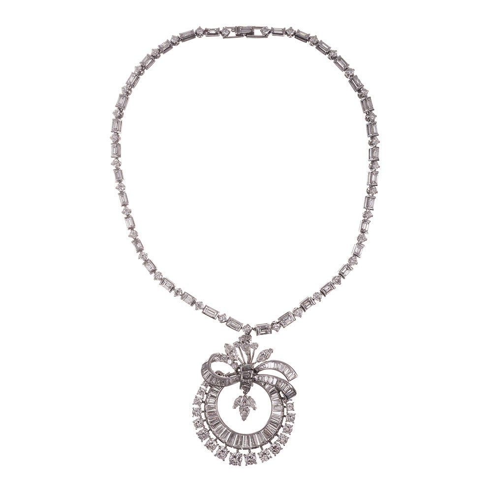 An absolutely stunning array of mixed cut diamonds, fashioned into a breathtaking pendant and suspended from a fitted necklace. In grande 1950s style, this piece will certainly earn some compliments and would be a magnificent addition to the