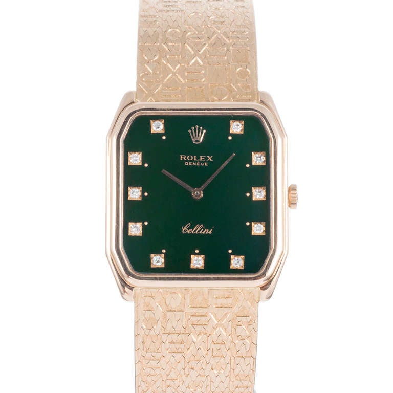 An 18k yellow gold Rolex Cellini dress watch with the Rolex's signature color dark green dial with diamond indexes, gently-shaped octagonal case and an extremely rare bracelet with Rolex 
