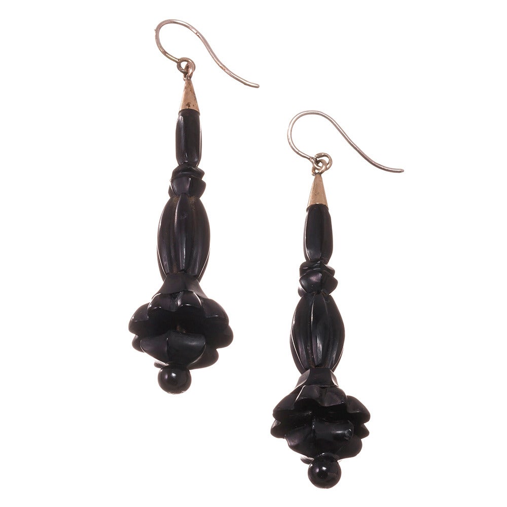 Dramatic length, measuring 3 inches including the ear wire, these carved Whitby Jet earrings are a hallmark of jewelry making from the Victorian era. Light weight and easy to wear, they are every bit as fashionably relevant today as the were over a